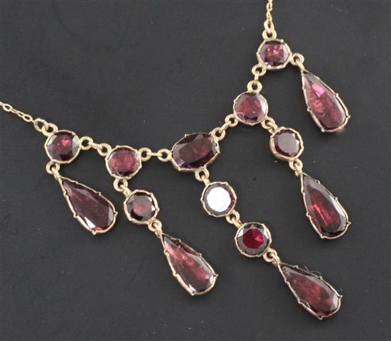 A Victorian gold and garnet drop necklace, 16in.